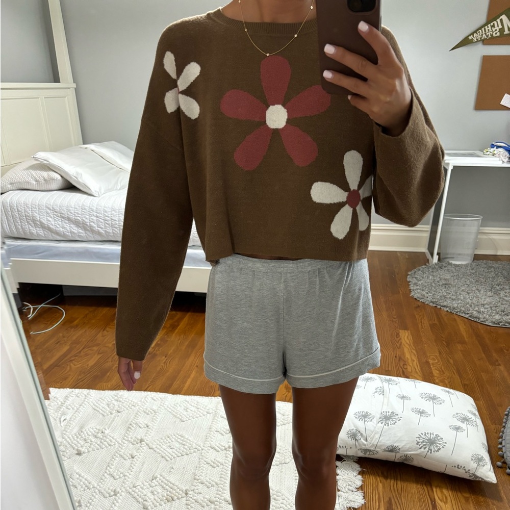 Brown sweater with flower pattern